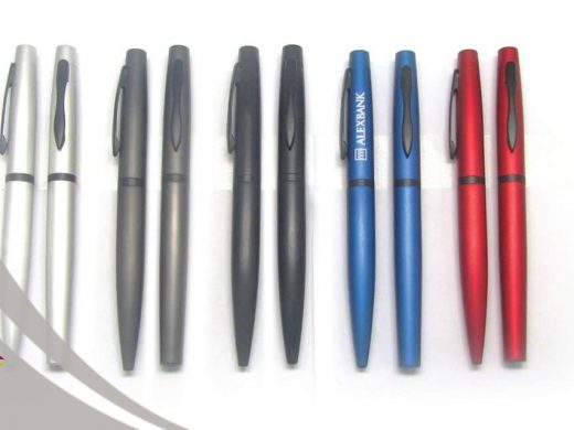 Set of twelve retractable metal pens in silver, black, blue, and red colors.