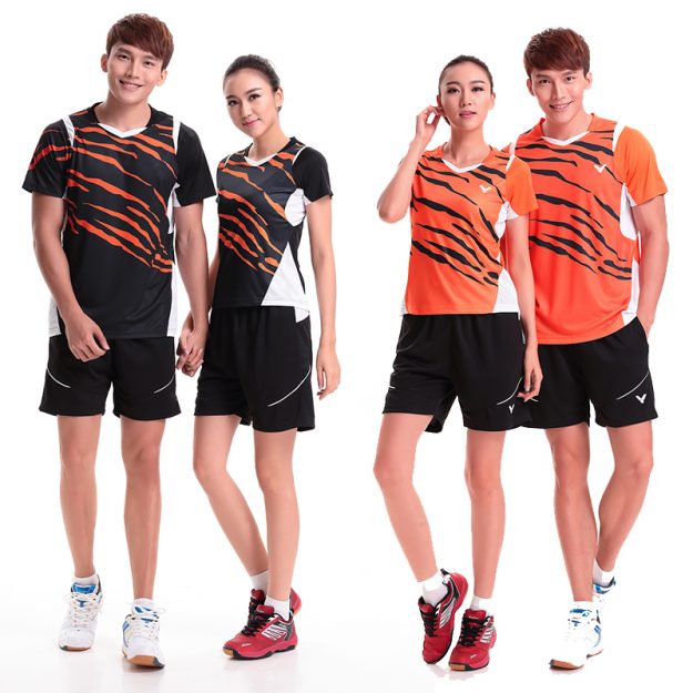 Dynamic athletic models showcasing orange and black tiger-stripe badminton sports uniforms.