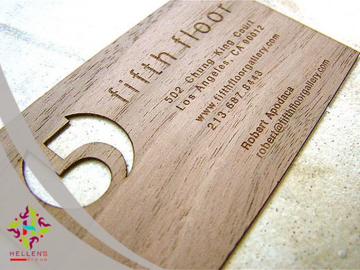 Laser-etched wooden business card with die-cut '5' for professional printing.