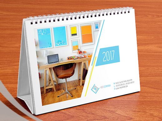Spiral-bound desk calendar mockup featuring modern office photo and "2017" branding.