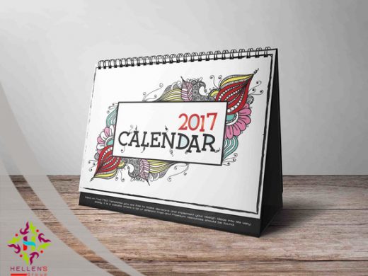 Desk calendar mockup 2017 with vibrant doodle patterns and spiral binding.