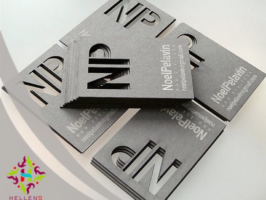 Thick gray business cards with die-cut 'NP' initials and white text.