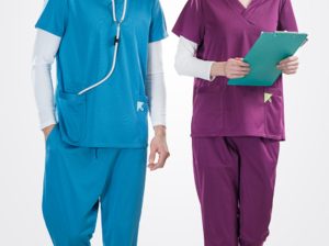 Modern medical professionals in vibrant cyan and plum scrubs with stethoscope and clipboard.