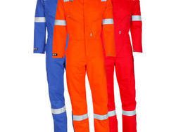 Three high-visibility industrial coveralls with reflective stripes for factory work.
