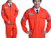 East Asian model wearing bright orange industrial safety uniform with reflective strips.