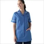 Smiling nurse in bright blue uniform tunic with white trim, standing against white.
